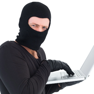 A person drress in black as if to steal data from a computer.