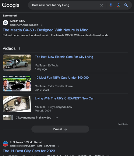 The Google search results for "Best new cars for city living", showing a sponsored ad from Mazda USA, videos, and a U.S. News & World Report link.